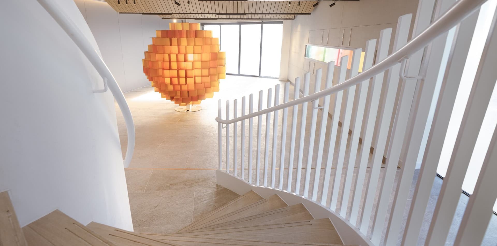 Port Ellen spiral stairs with a large orange ornament on the ceiling