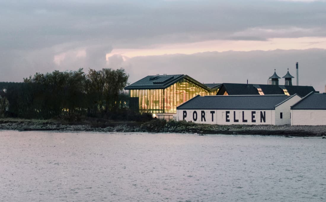 Port Ellen Distillery beside a lake