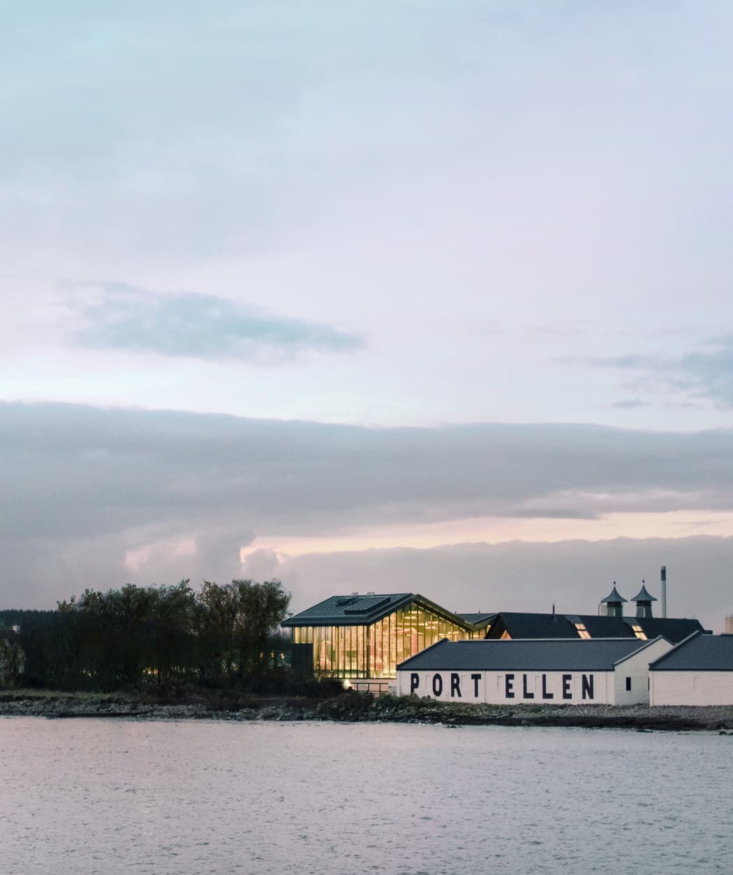 The Port Ellen Distillery beside a lake