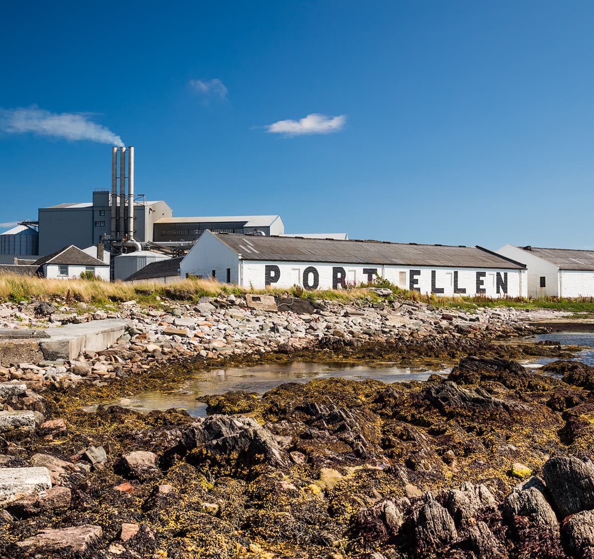 Port ellen distillery with ocean in the foreground