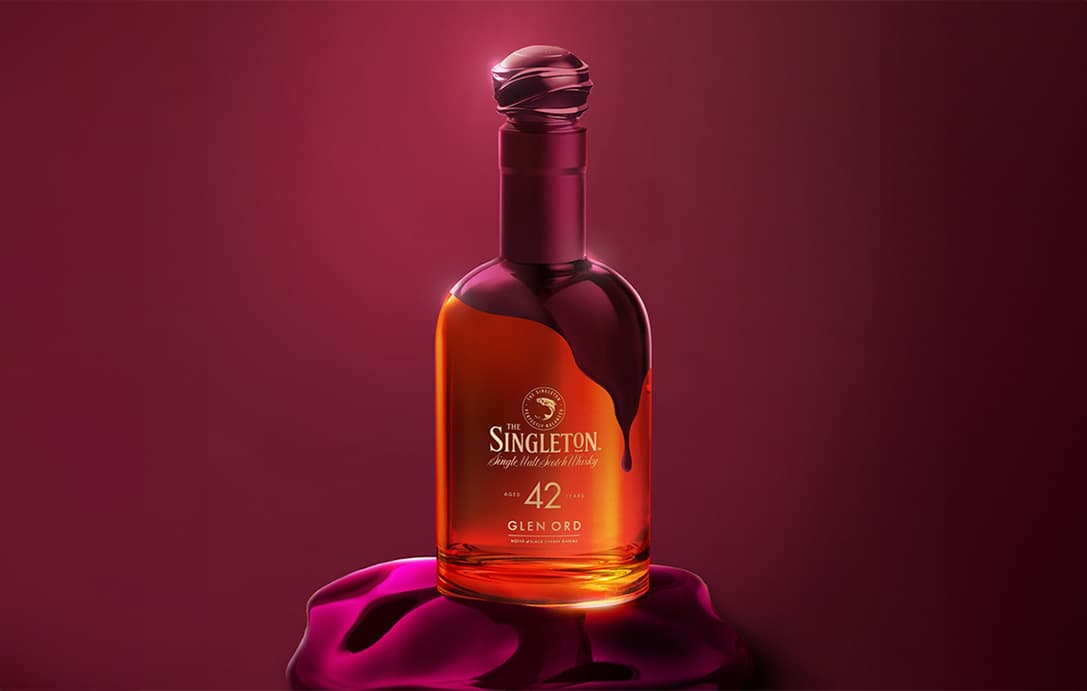 A bottle of The Singleton Gourmand 42 Year Old on top of a pink cloth